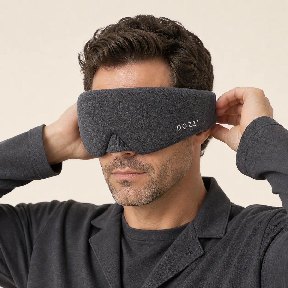 Man adjusting the wrap of his Black DOZZI mask